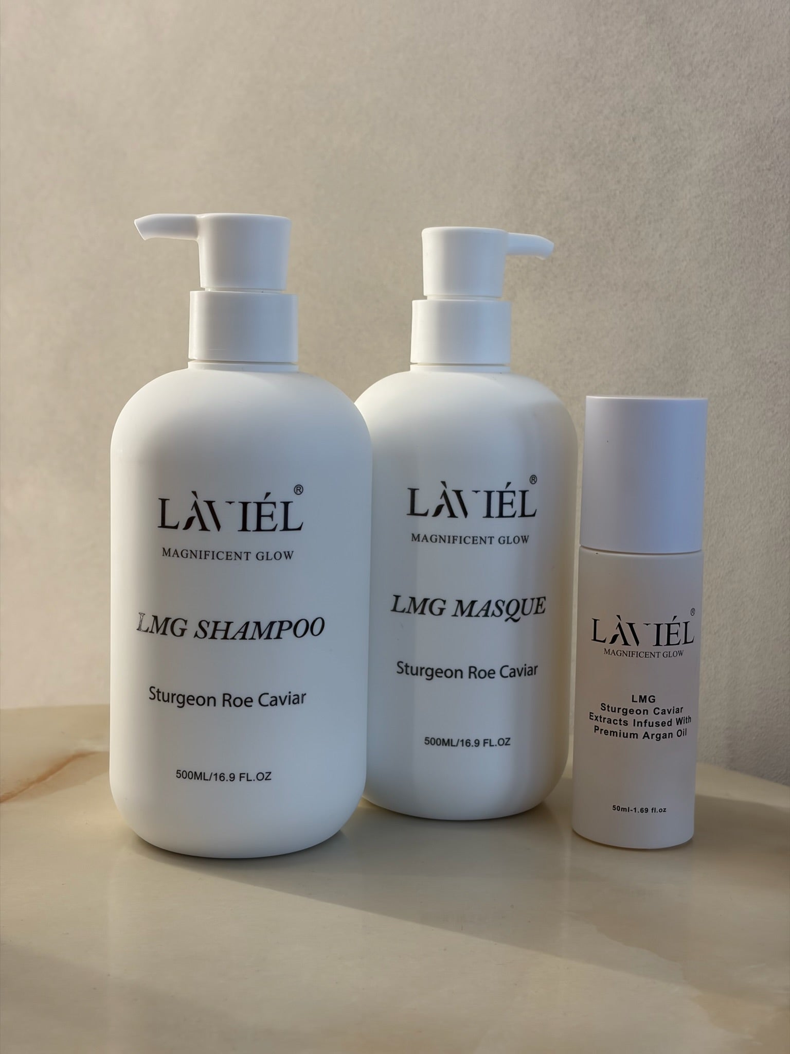 Three Lavièl haircare products on a beige background
