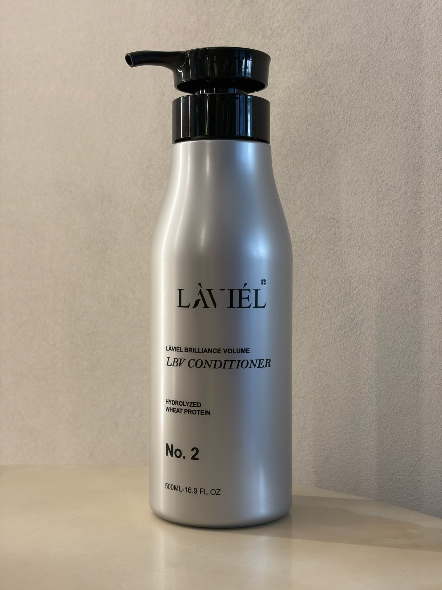 Laviel conditioner bottle on a neutral background