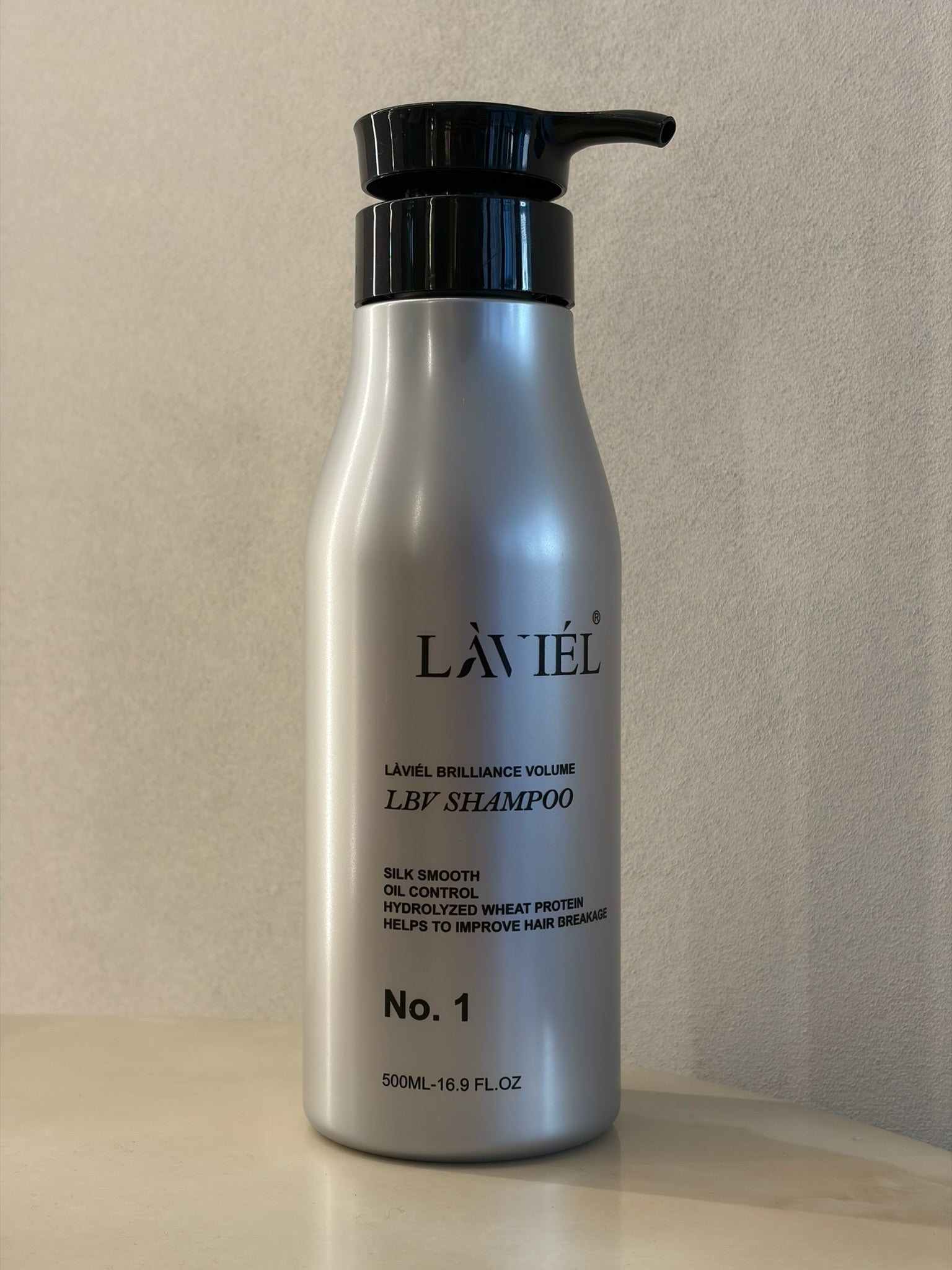 Laviel shampoo bottle on a neutral background