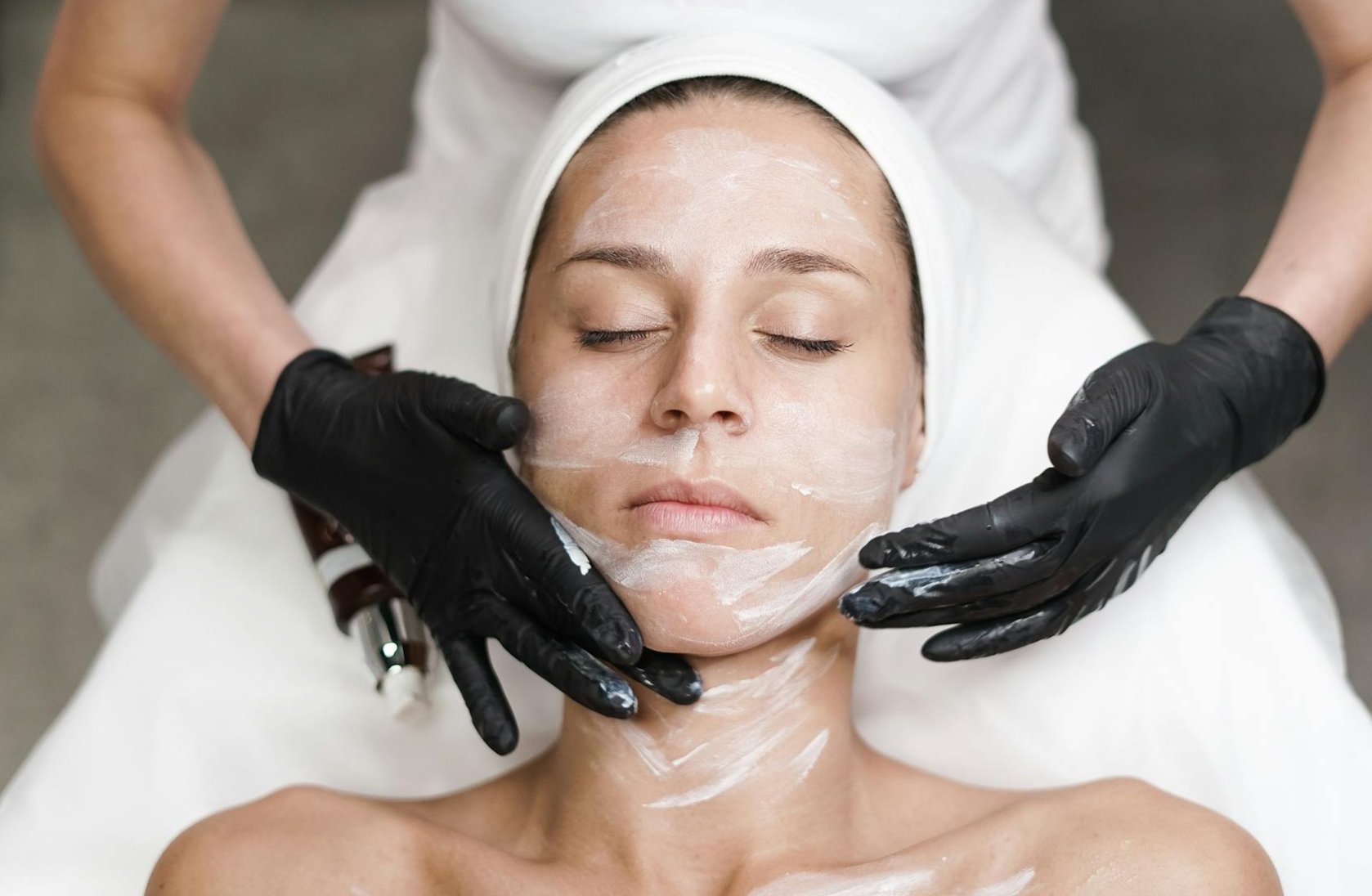 A customer receiving a facial with verify caviar therapy